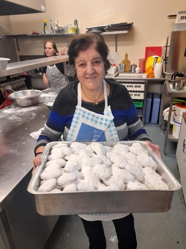 Ladies making kourabiedes to support the community